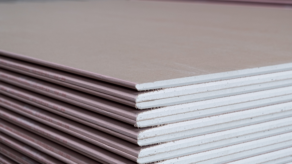 Stack of fire-resistant drywall plasterboards ready for installation