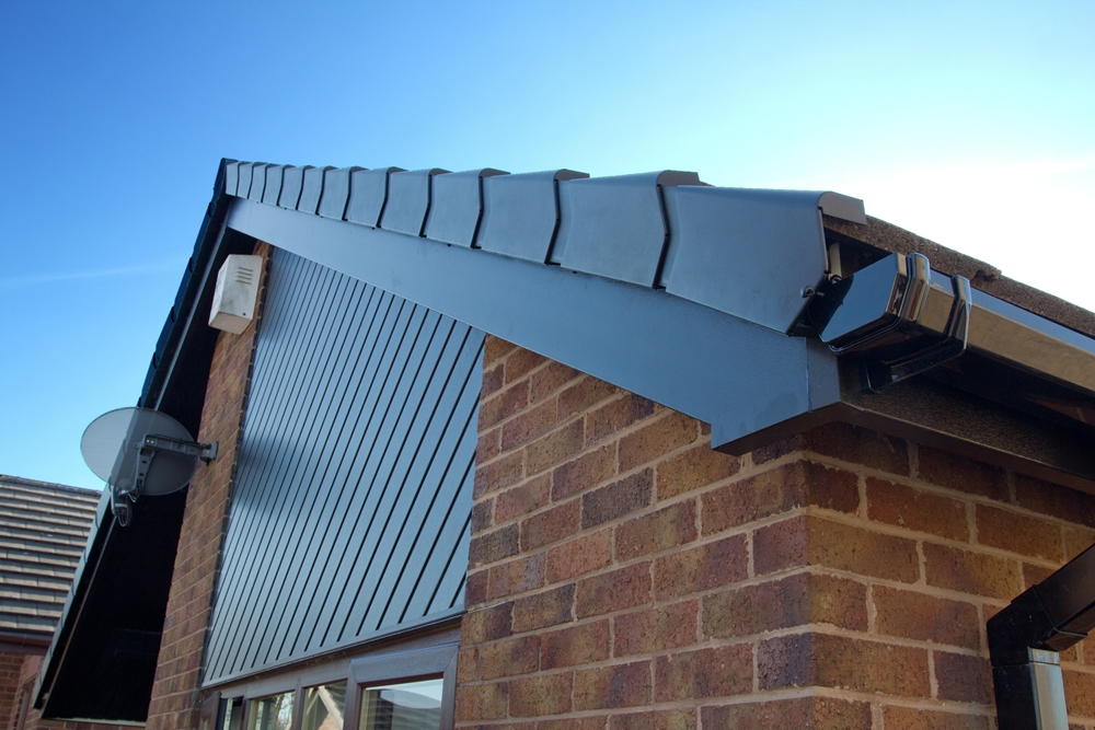 uPVC roofline with fascia and guttering installed on brick house exterior