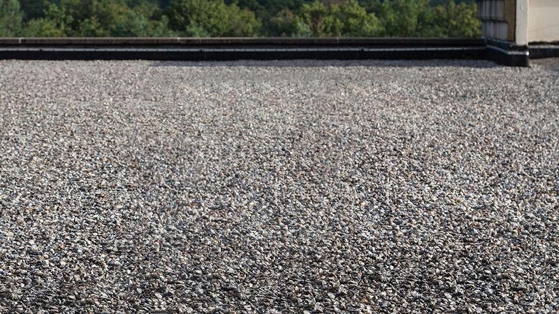 Built-up roofing (BUR) with a gravel surface on a flat roof